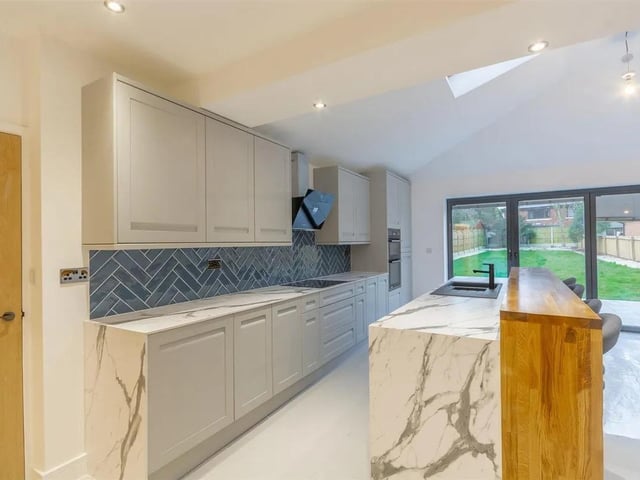 This beautifully renovated six-bedroom detached home offers modern luxury in a sought-after location. At the heart of the property is a stunning open-plan kitchen, designed with family life in mind. Featuring integrated appliances, a breakfast bar, and ample space for dining, it flows seamlessly into a stylish living area complete with a bespoke media wall and feature fireplace. Bifold doors open onto the garden, creating a bright, contemporary indoor/outdoor lifestyle.