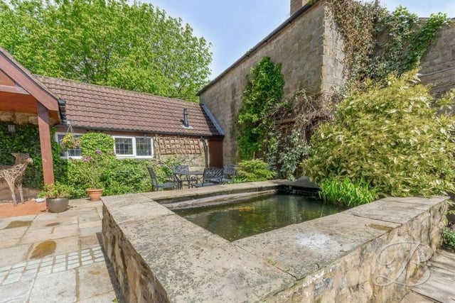 A highlight of the garden at the £485,000 Kirkby Hardwick barn conversion is this decorative pond, which sits by the patio area.