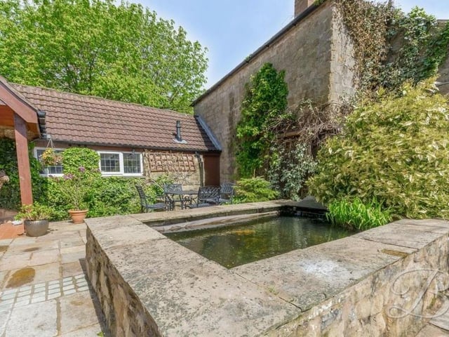 A highlight of the garden at the £485,000 Kirkby Hardwick barn conversion is this decorative pond, which sits by the patio area.