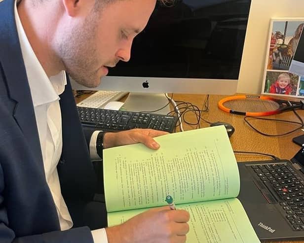 Coun Ben Bradley reads through the Bill Committee papers for the Levelling Up and Regeneration Bill