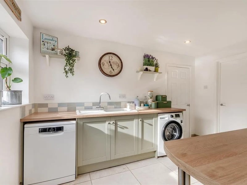 The utility features plumbing and space for a dishwasher. Plumbing for a washing machine and space for a tumble dryer and a range of base units and work surfaces.