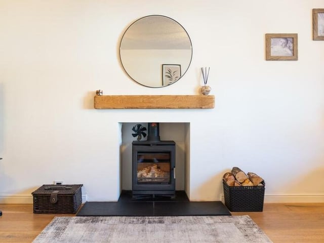 Here is a close-up of the attractive log-burning stove that is a focal point in the lounge.