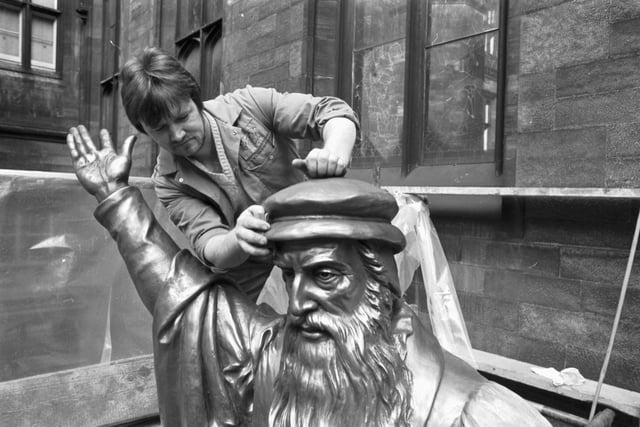 David Ferguson gives the statue of Scottish religious reformer John Knox a spring clean in April 1982.