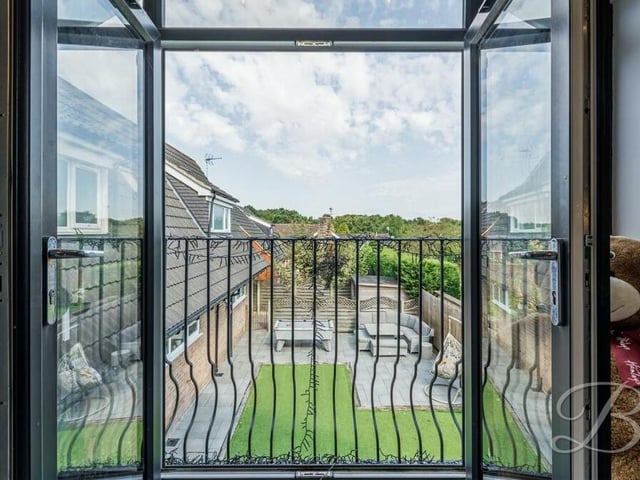 Here is the view from the bedroom balcony, overlooking the landscaped rear garden.
