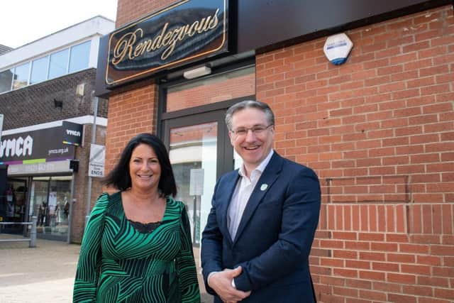 Cafe owner Tricia Ironside and Coun Matthew Relf outside Rendezvouz on Low Street, Sutton town centre.