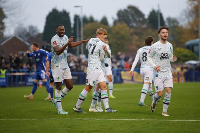 Mansfield Town eased to a comfortable 4-0 win at Curzon Ashton to progress in the FA Cup.