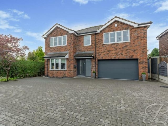 Back to the front of the house for a closer look at the private, block-paved driveway, which provides plenty of space for off-street parking, and the integral garage.