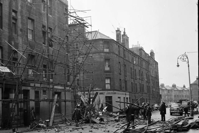 Fallen masonry and twisted metal scaffolding in Leith's Graham Street following a storm in December 1962.
