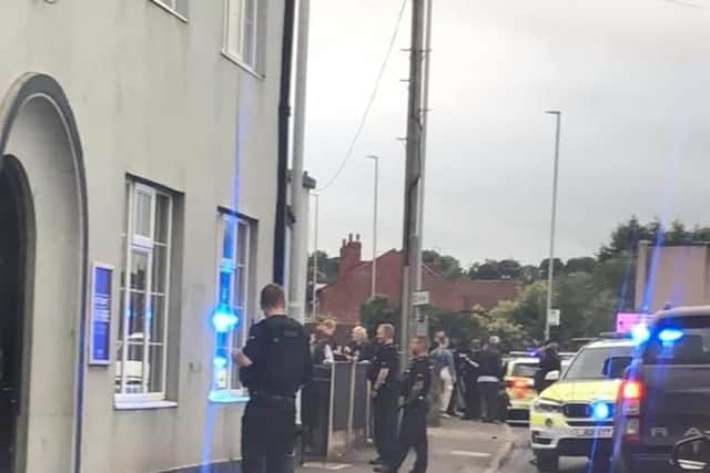 Police officers outside the Jug and Glass in Mansfield Woodhouse.