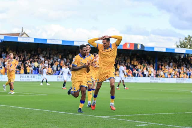 Mansfield Town midfielder Nathan Moriah-Welsh (22) celebrates his second goal with Kyle Knoyle (02) and Jon Russell (13) during the Sky Bet League 1 match against Luton Town FC at the One Call Stadium, 30 Aug 2026, Photo credit Chris & Jeanette Holloway / The Bigger Picture.media