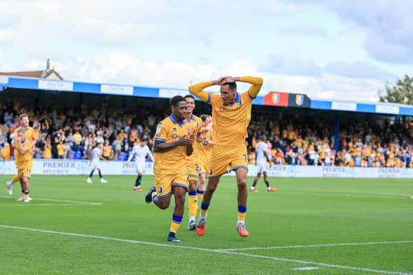 Mansfield Town midfielder Nathan Moriah-Welsh celebrates his second goal with Kyle Knoyle and Jon Russell during the Sky Bet League 1 match against Luton Town FC at the One Call Stadium, 30 Aug 2026, Photo credit Chris & Jeanette Holloway / The Bigger Picture.media