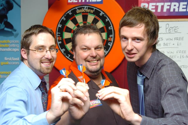 Free Press reporter Paul Goodwin challenged former world number one darts player Peter Manley, as he visits Betfred on Cleveland Street, and raised money for Doncaster Cancer Detection Trust. L-R are Betfred shop Manager Ryan Webster, Peter Manleyl, and Paul Goodwin