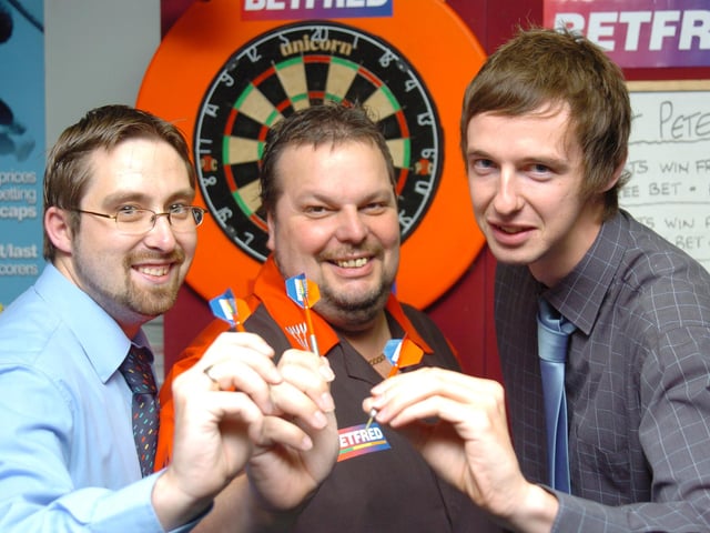 Free Press reporter Paul Goodwin challenged former world number one darts player Peter Manley, as he visits Betfred on Cleveland Street, and raised money for Doncaster Cancer Detection Trust. L-R are Betfred shop Manager Ryan Webster, Peter Manleyl, and Paul Goodwin