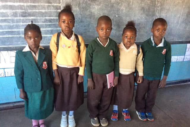 Zambian school children with shoes the charity provided. Many children have no shoes at all. - Picture: Joan Green