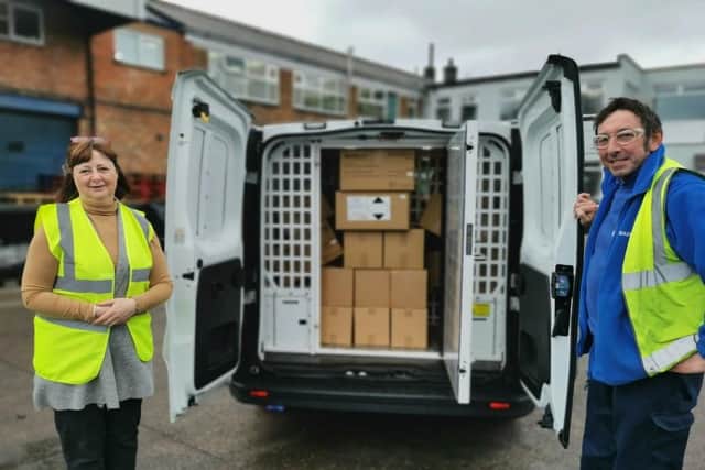 Quadralene Ltd dispatch operative Liam O’Sullivan and customer services advisor Julie Pollard with the van-load of products the firm has donated to Nottinghamshire Police.
