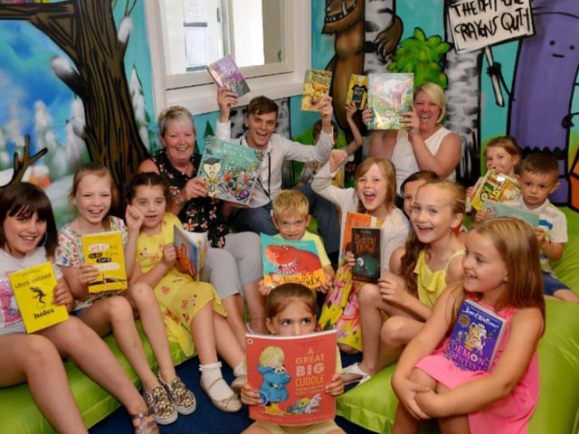 Celebrating the opening of the newly-refurbished library at Python Hill Academy in 2018  are KS2 phase leader Daniel Webster, Sharon Newey and Clair Newey.