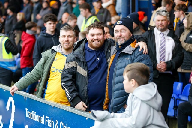 Mansfield fans at the Sky Bet League 2 match against Stockport County FC at Edgeley Park, 01 Jan 2024. 
Photo credit should read : Chris & Jeanette Holloway / The Bigger Picture.media:Mansfield Town fans enjoy the win at Stockport County.