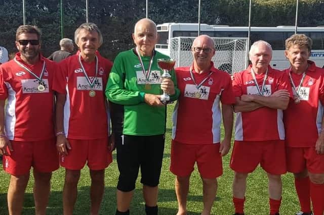 Mansfield Walking Reds with their trophy in Italy.