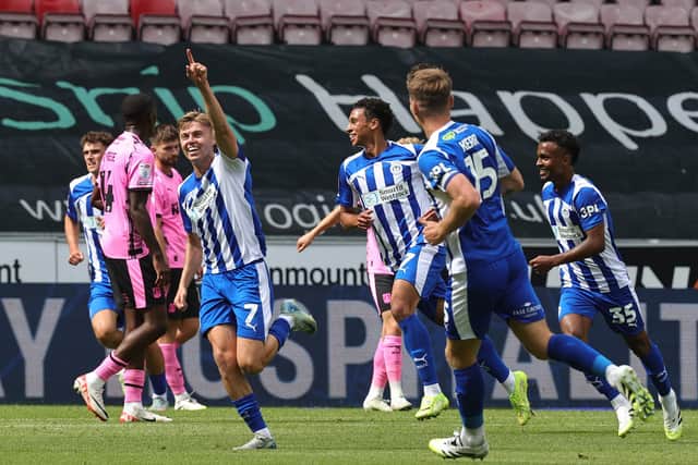 Fraser Murray of Wigan Athletic celebrates after scoring his sides first goal during the Sky Bet League One match between Wigan Athletic and Northampton Town at The Brick Community Stadium on August 02, 2025 in Wigan, England. (Photo by Pete Norton/Getty Images)