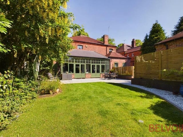 Stepping outside, here is a view of the rear of the £795,000 property, where a newly landscaped garden catches the sun all day. A mature, lawned garden features a pond, a fountain, a gravelled pathway and hedging that guarantees privacy