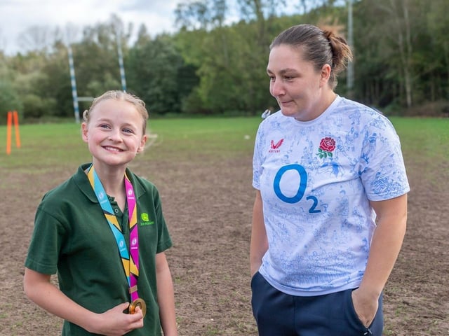 Mansfield U12 player admiring the Rugby World Cup Winners Gold medal
