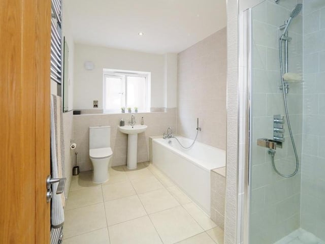 Moving upstairs now, and a look at the stylish family bathroom. It comprises bath, shower cubicle, wash hand basin and low-flush WC.