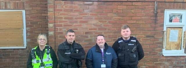 Officers and councillors outside the property.