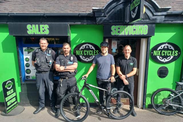 Dan Roizer, second from right, with his new bike thanks to Nix Cycles and police.