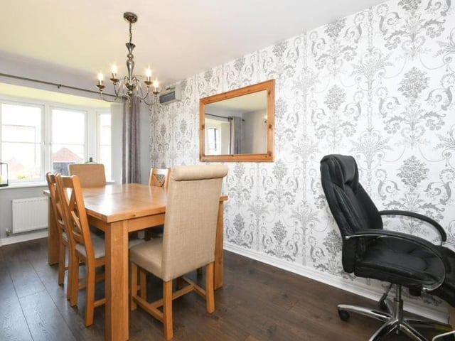 The reception room at the front of the Sutton property is this dining room. Again it is a bright room, with plenty of space.