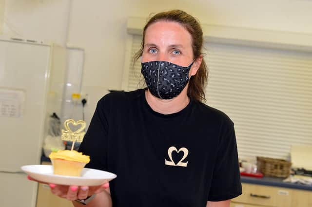 Serving up cakes and kindness - Cafe 22 at the Ashwood Centre Portland Street, Kirkby.  Pictured: Louise Webber who runs the cafe pictured at the the recent grand reopening.