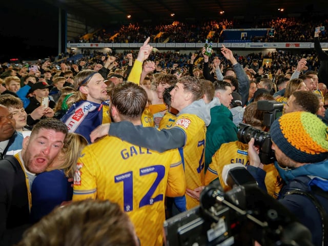 Mansfield Town's fans and players celebrated promotion to League One long into the night.