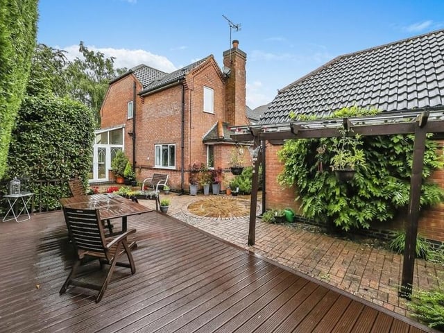 It might have been wet when this photo was taken -- but this decking area in the garden provides the perfect spot for relaxing in the sunshine during summer.