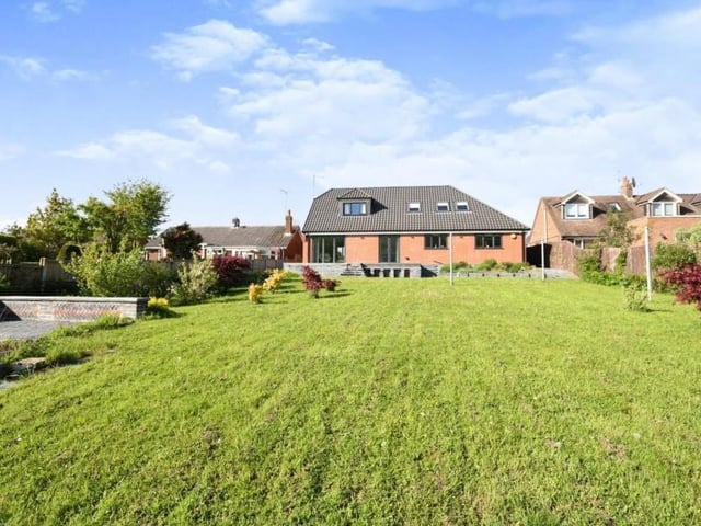 As we complete our tour of the £600,000 Mansfield dormer bungalow, here is a view of the property from the rear, stretching down the lawned garden.