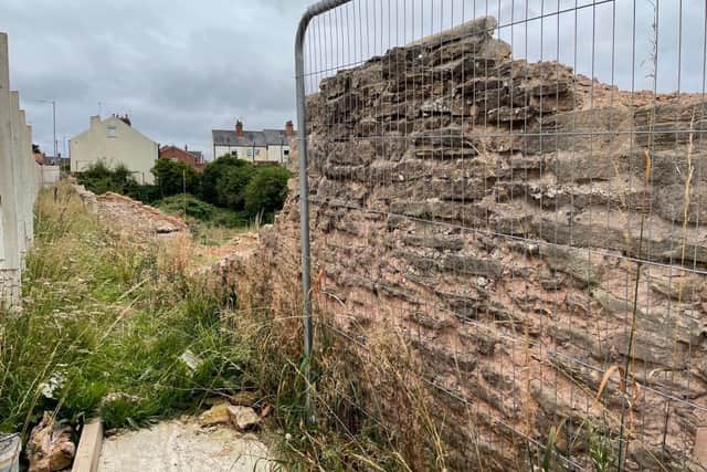Part of the damaged wall.