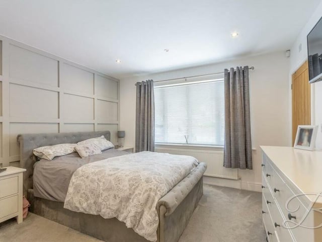 Bedroom number two also faces the front of the Lansdowne Avenue home, and has access to an en suite shower room. Other features are decorative panelling, a carpeted floor, downlights and space for storage drawers.