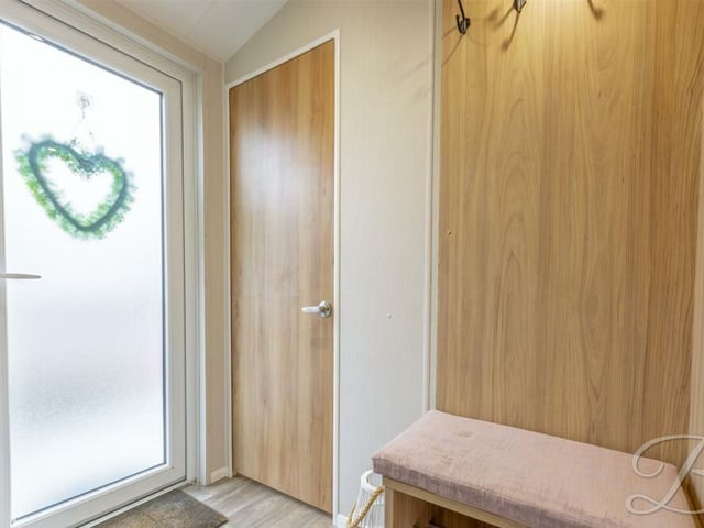 A welcoming entrance hall leads the way and the heart decoration could be symbolic if you fall in love with the £130,000 mobile home.