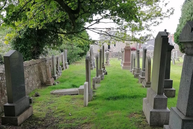 Looking along the rows of headstones at Abbotshall Cemetery