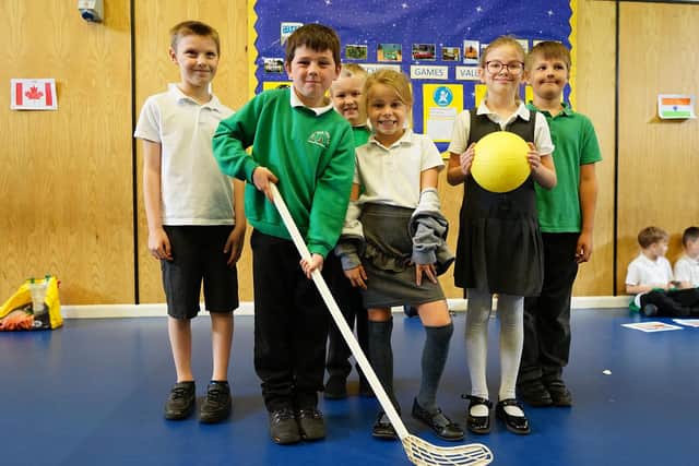 Youngsters at Oak Tree Primary in Mansfield celebrate the school winning the gold School Games Award.