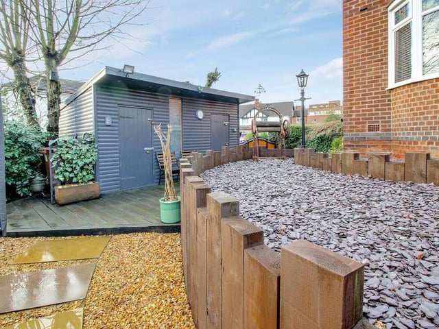 The current owner of the house has built this impressive shed or 'man cave', which sits neatly in the front garden.