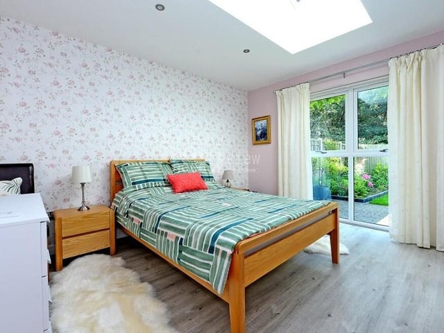 Bedroom number two is a bonny and bright space, complete with floor-to-ceiling windows, a roof light window with electric blind and plenty of room for furniture.