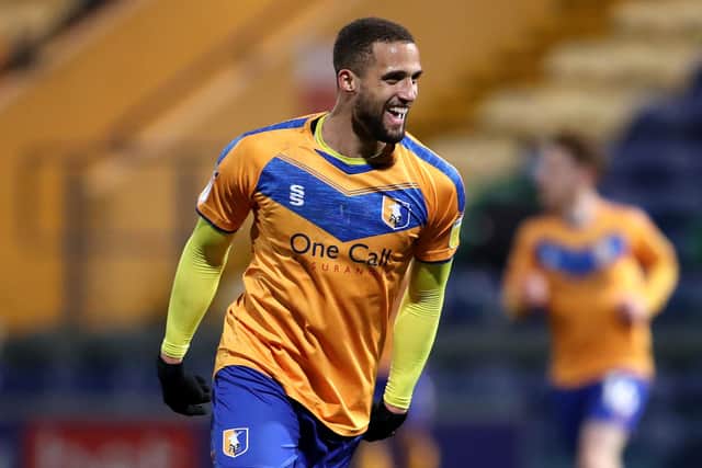 Jordan Bowery celebrates scoring Mansfield Town's third goal against Cheltenham Town. (Photo by Alex Pantling/Getty Images)