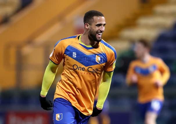 Jordan Bowery celebrates scoring Mansfield Town's third goal against Cheltenham Town. (Photo by Alex Pantling/Getty Images)