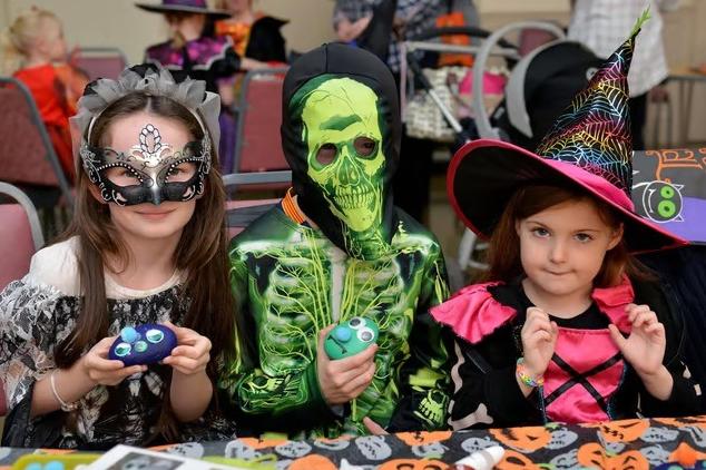 Pictured from left are: Sienna Flannagan, eight, Sean Flannagan, nine and Lilith Thompson, four, taking part in the Spooky Make and Bake session at Selston Parish Hall