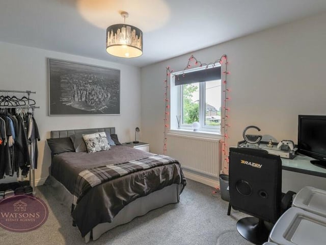The second bedroom in our gallery is a good-sized double, with space for a desk. Both this bedroom and number three have access to a shared en suite.