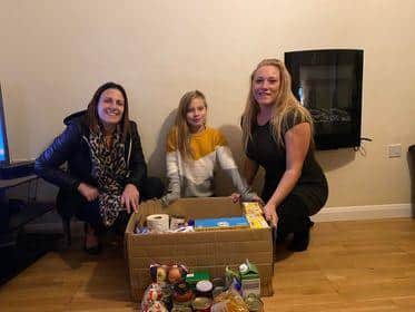 Lisa Barnes, administrator of Happy Tummies, Gracie-Alexis Frew, daughter of Lisa Flint, and Lisa Flint founder of Happy Tummies.