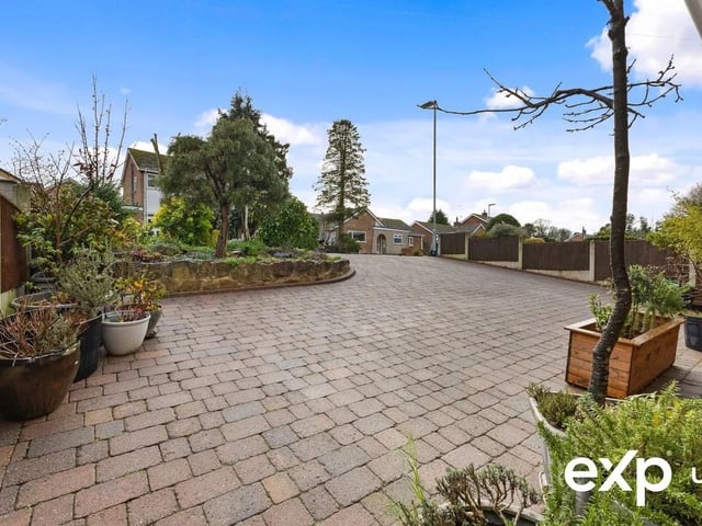 Occupying a fabulous position in a good-sized plot, the charming façade presents elegant touches, making a great first impression. An extensive driveway giving ample off-road private parking for numerous vehicles is enhanced by landscaping to the front with pretty shrubs and established planting set within rockery borders.