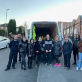 Bogusia Kavanagh is pictured  (with glasses fifth from left)  with  other people helping to collect items for the Ukrainian refugees  - including representatives from Savanna Rags a Mansfield textile recycling company, Taylors Transport, at Huthwaite, as well as people from Mansfield and other areas.