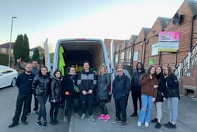 Bogusia Kavanagh is pictured  (with glasses fifth from left)  with  other people helping to collect items for the Ukrainian refugees  - including representatives from Savanna Rags a Mansfield textile recycling company, Taylors Transport, at Huthwaite, as well as people from Mansfield and other areas.
