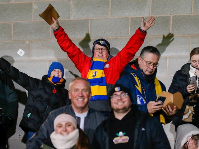 Some of the Mansfield Town fans who headed to Burton for the EFL Trophy defeat.