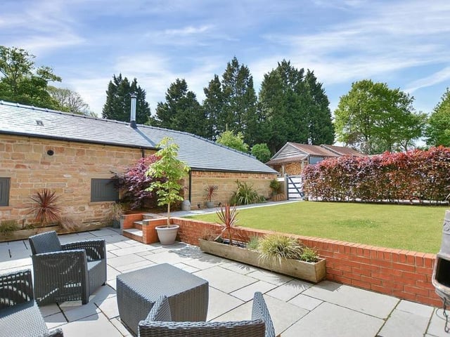 With its raised lawn and Indian sandstone patio, the back garden is a lovely place to relax or entertain family and friends.